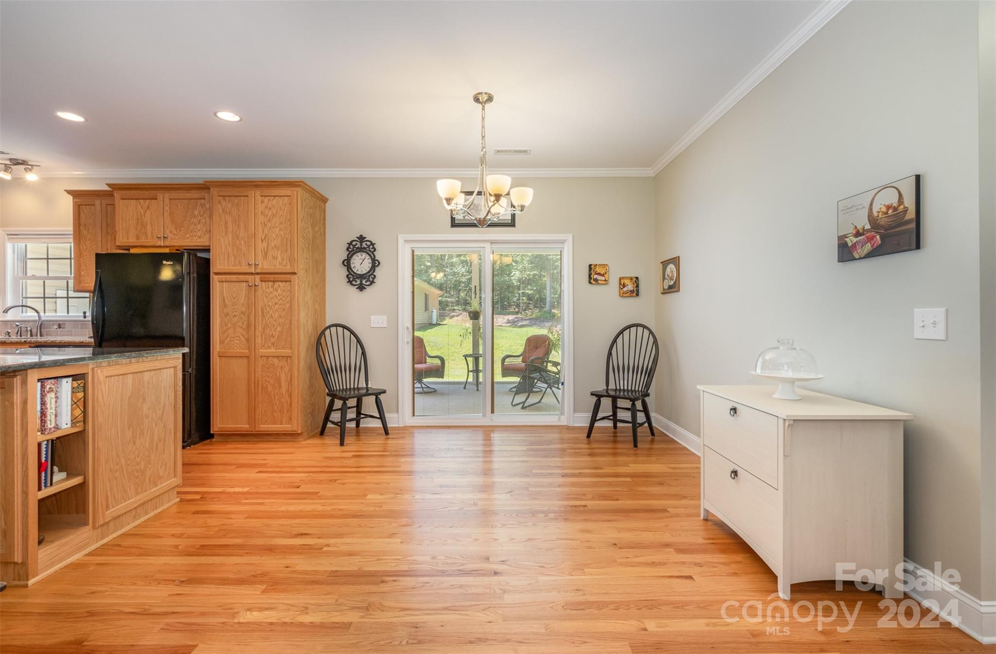 218 Old Hickory Road Locust, NC 28097 - Photo 11 of 38 a living room with furniture a flat screen tv and kitchen view