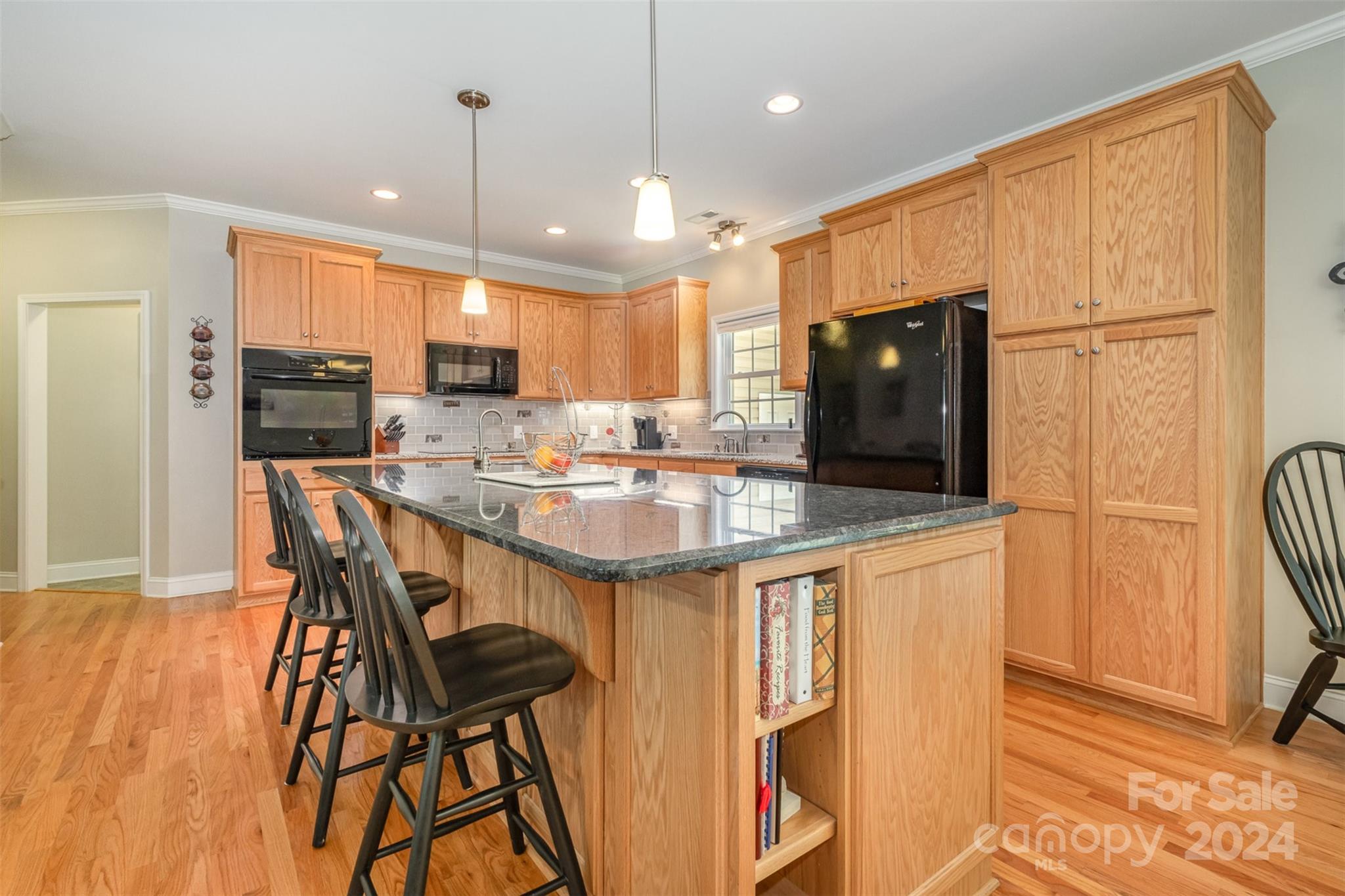 218 Old Hickory Road Locust, NC 28097 - Photo 15 of 38 a kitchen with stainless steel appliances kitchen island granite countertop a sink a stove and a refrigerator