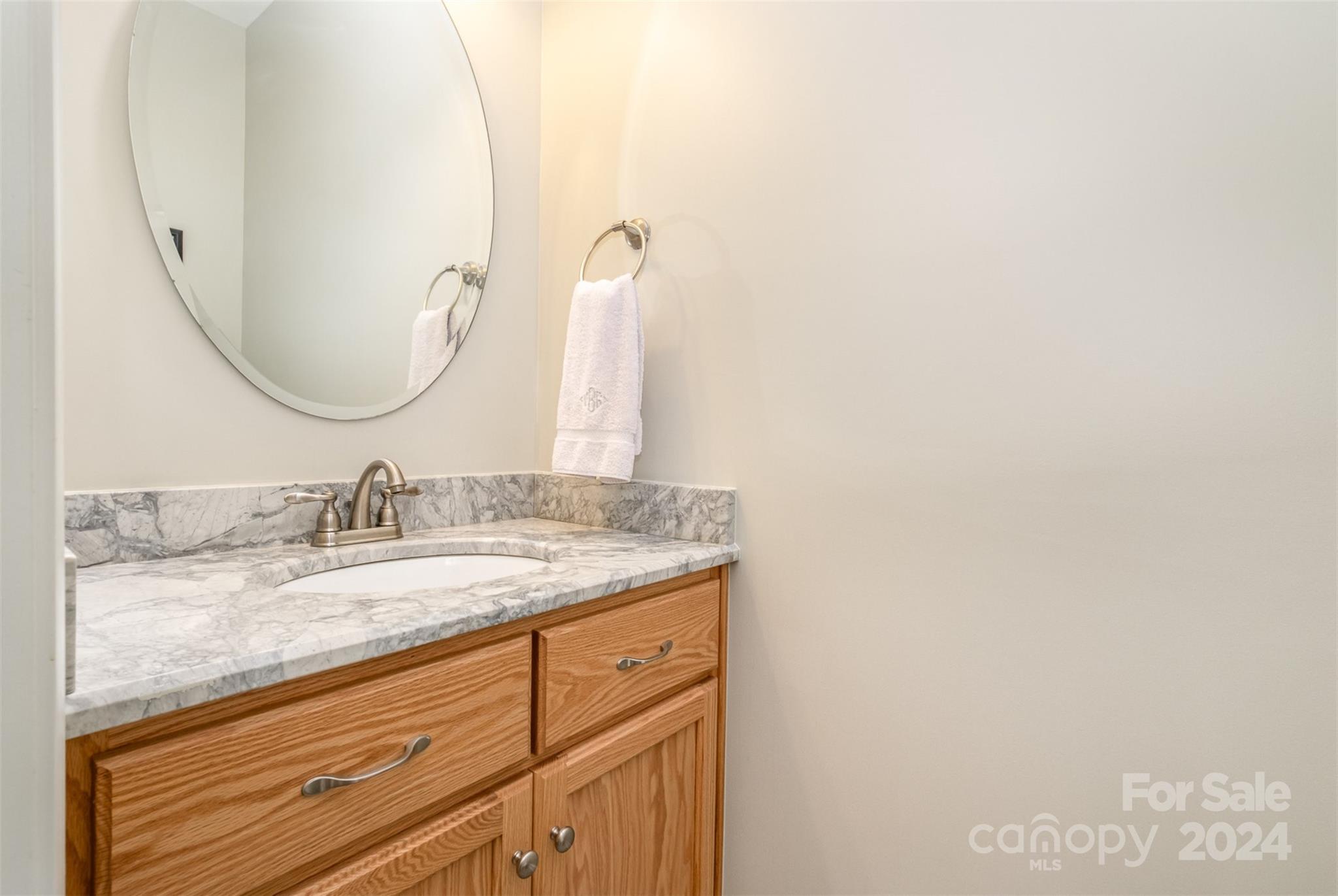218 Old Hickory Road Locust, NC 28097 - Photo 17 of 38 a bathroom with a granite countertop sink and a mirror