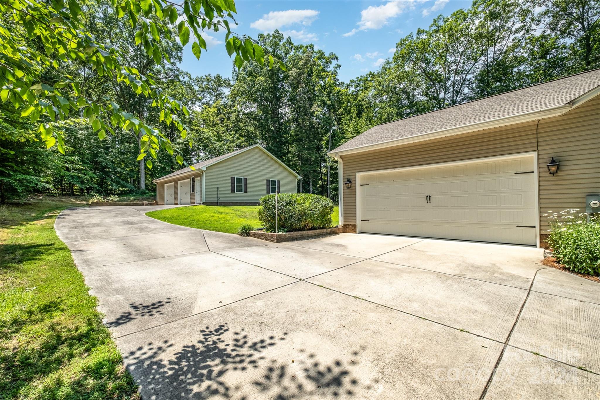 218 Old Hickory Road Locust, NC 28097 - Photo 3 of 38 a house with trees in front of it