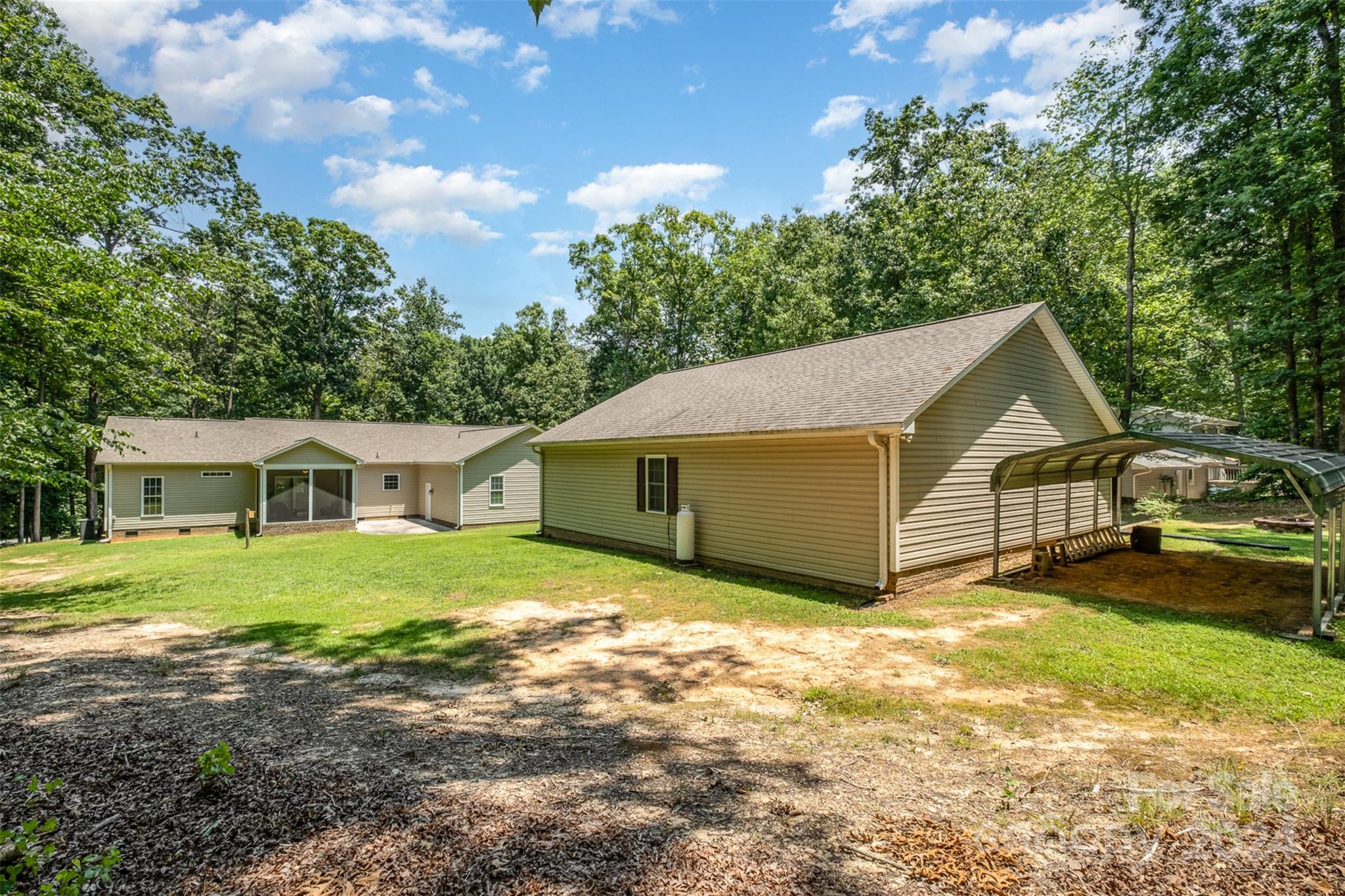 218 Old Hickory Road Locust, NC 28097 - Photo 32 of 38 a view of a house with a yard