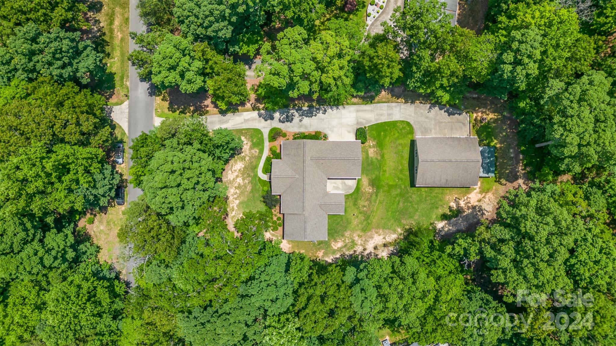 218 Old Hickory Road Locust, NC 28097 - Photo 35 of 38 an aerial view of a house with a yard and trees all around