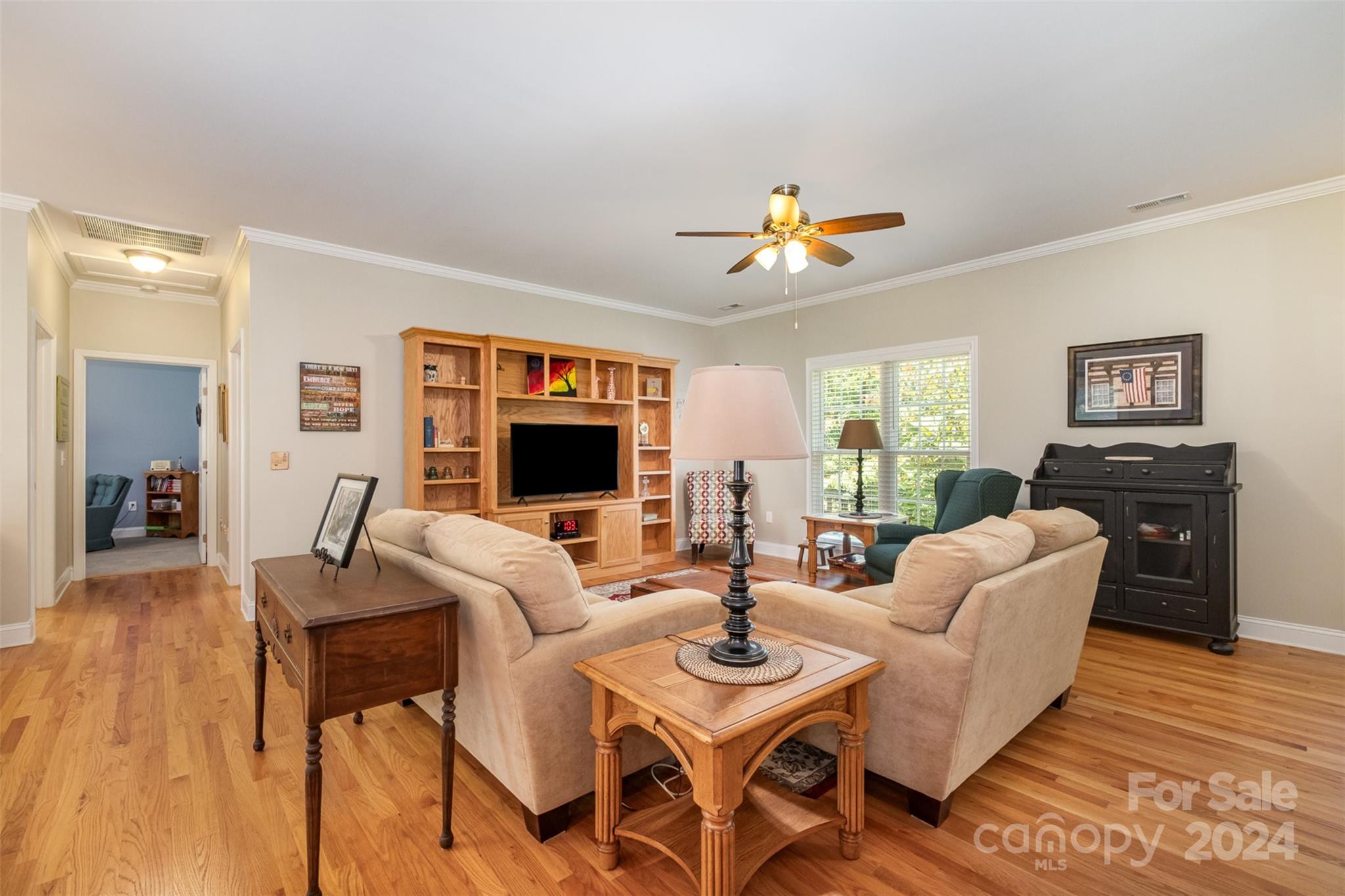 218 Old Hickory Road Locust, NC 28097 - Photo 8 of 38 a living room with furniture a flat screen tv and a table