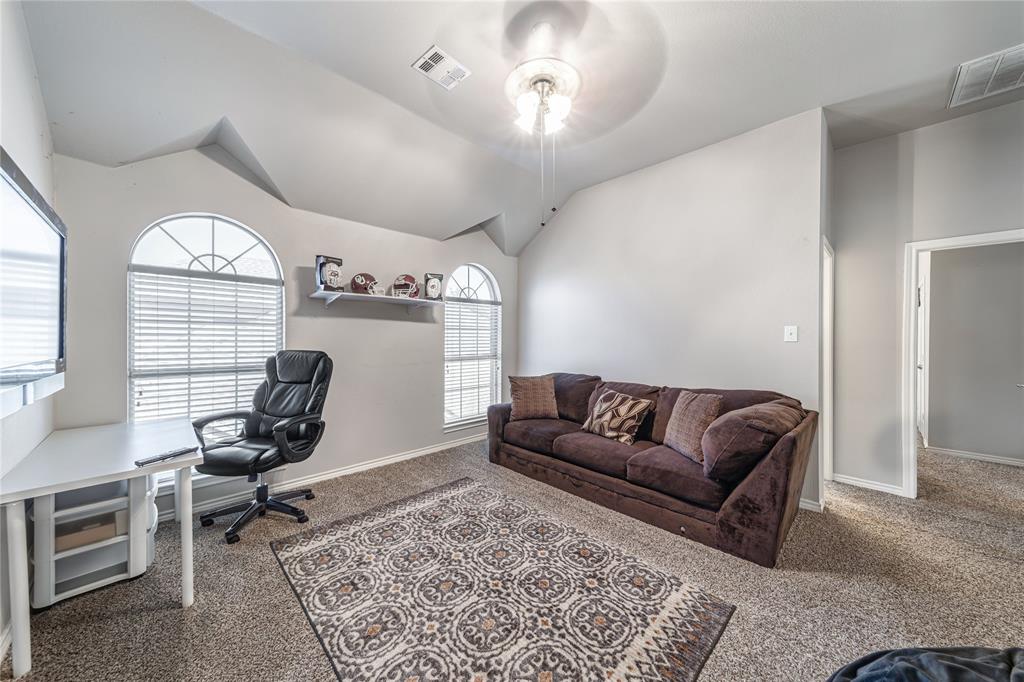 8001 St Fillans Lane Rowlett, TX 75089 - Photo 16 of 40 a living room with furniture rug and window