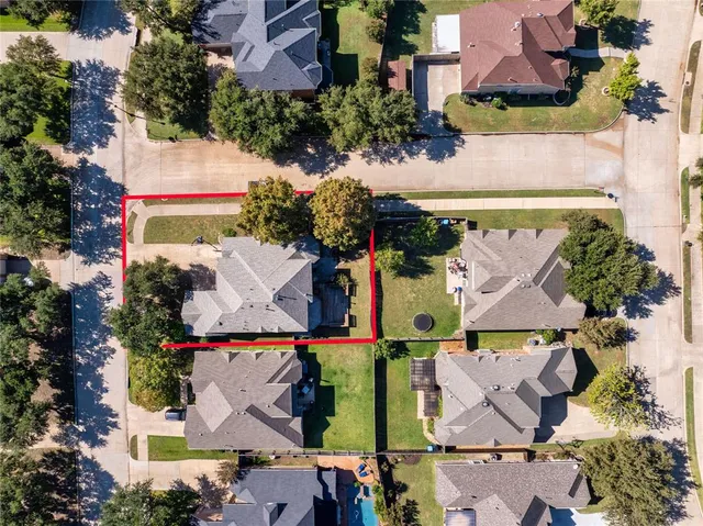 an aerial view of houses with outdoor space