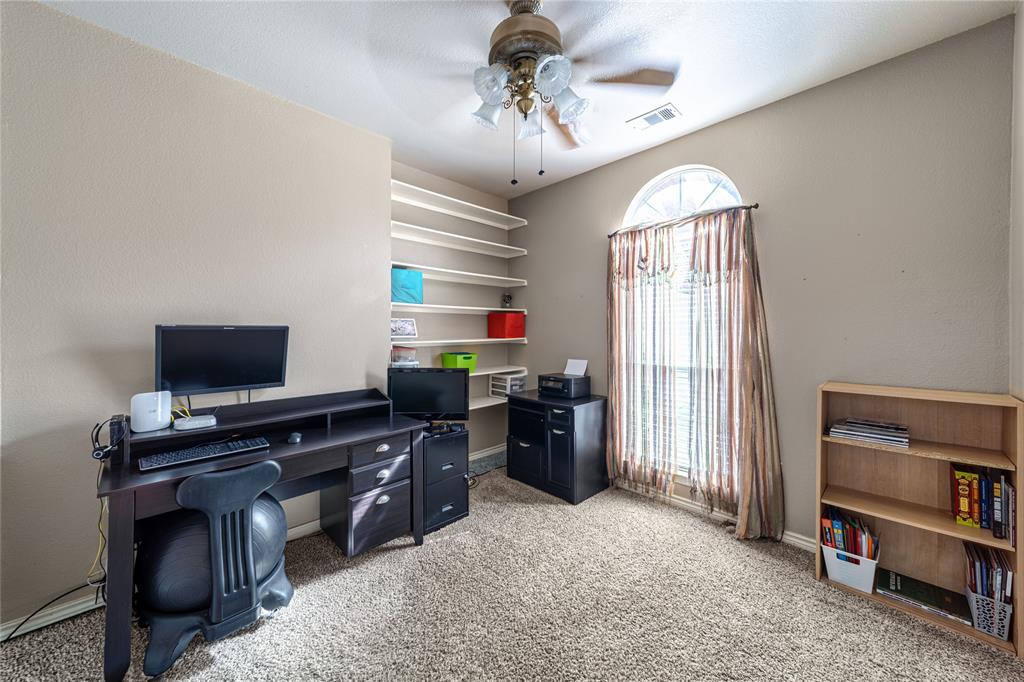 8001 St Fillans Lane Rowlett, TX 75089 - Photo 30 of 40 a view of a workspace with furniture and a window