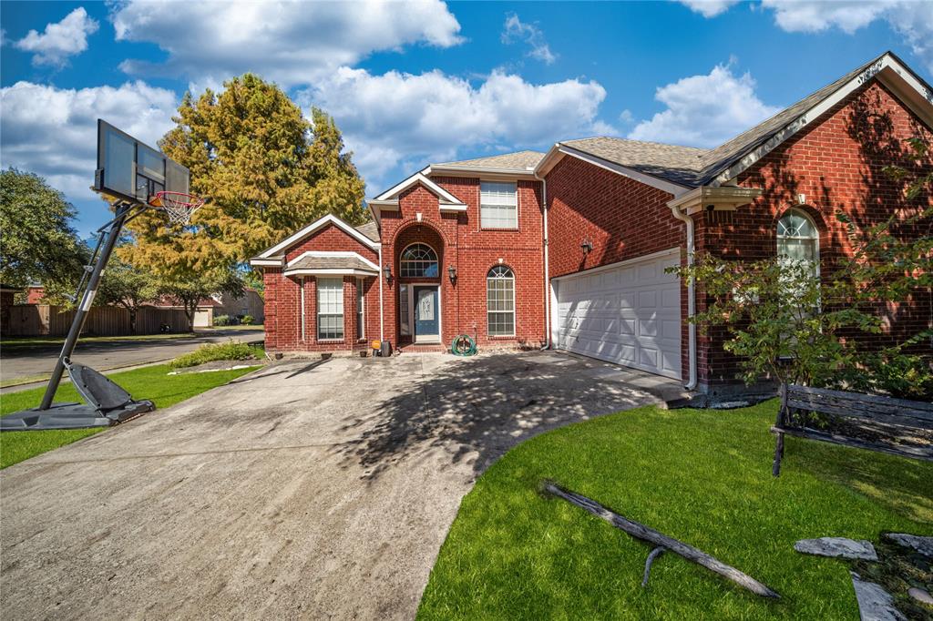 8001 St Fillans Lane Rowlett, TX 75089 - Photo 8 of 40 a front view of a house with a yard