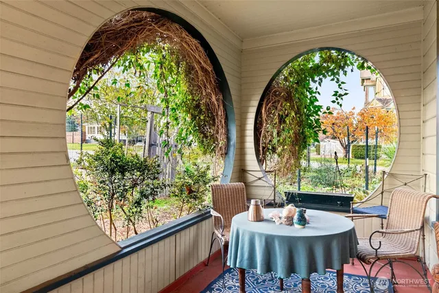 a view of a hallway with paintings on the wall
