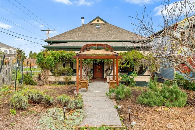 a view of a patio with table and chairs under an umbrella