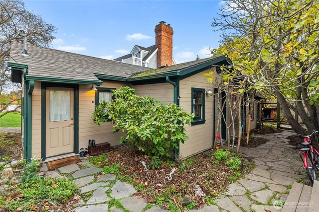 a view of a livingroom with furniture and a window