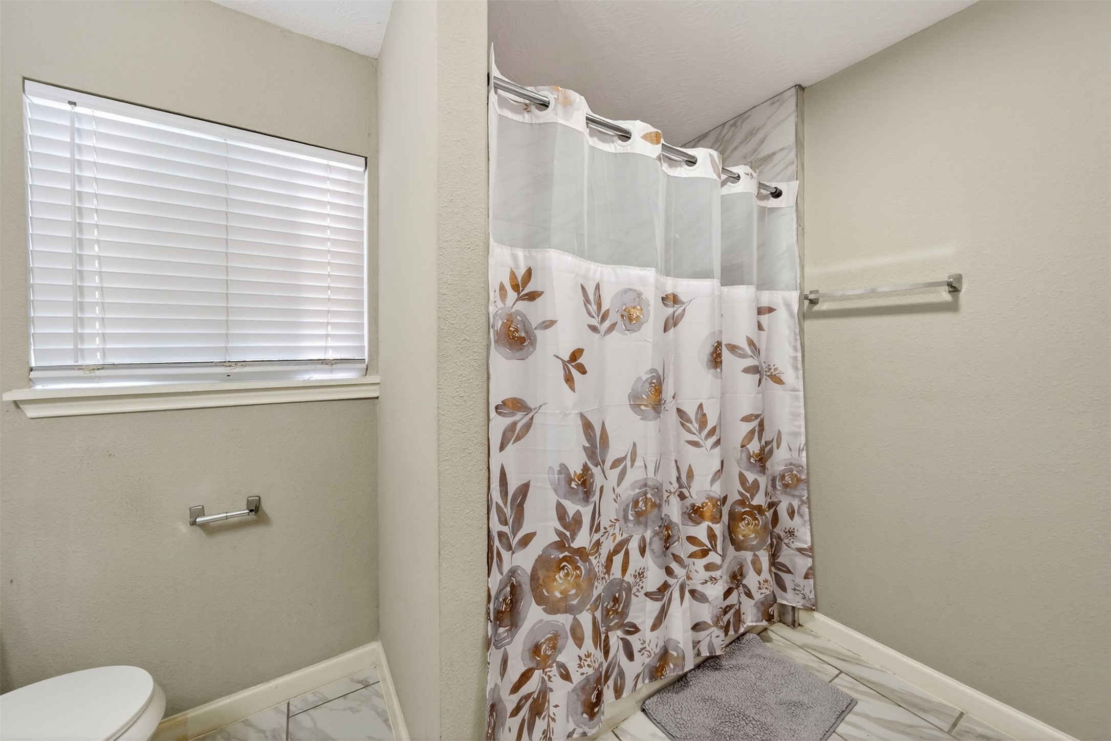 1107 Christine Street Houston, TX 77017 - Photo 14 of 22 a bathroom with a shower curtain and a window