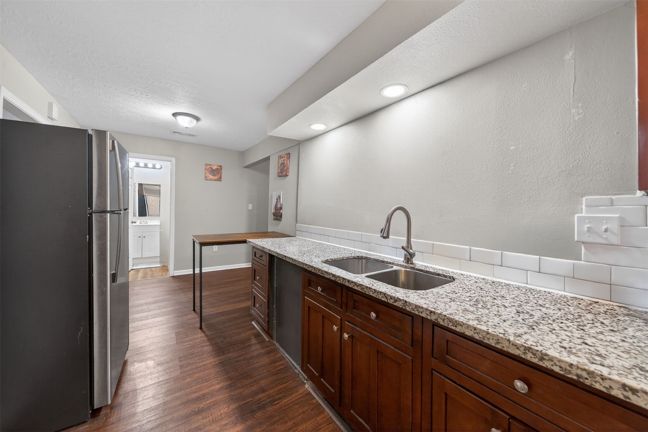 1107 Christine Street Houston, TX 77017 - Photo 3 of 22 a kitchen with a sink and refrigerator