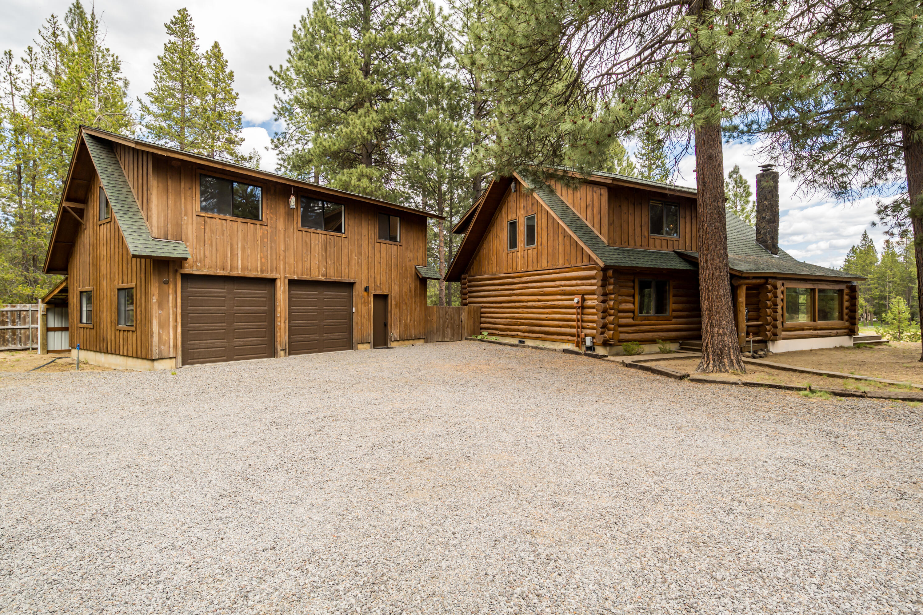 17026 Sharp Drive Bend, OR 97707 - Photo 4 of 72 a front view of a house with a yard and garage