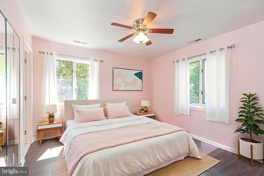 63 Drawbridge Road Ocean Pines, MD 21811 - Photo 24 of 102 a bedroom with a large bed and a potted plant