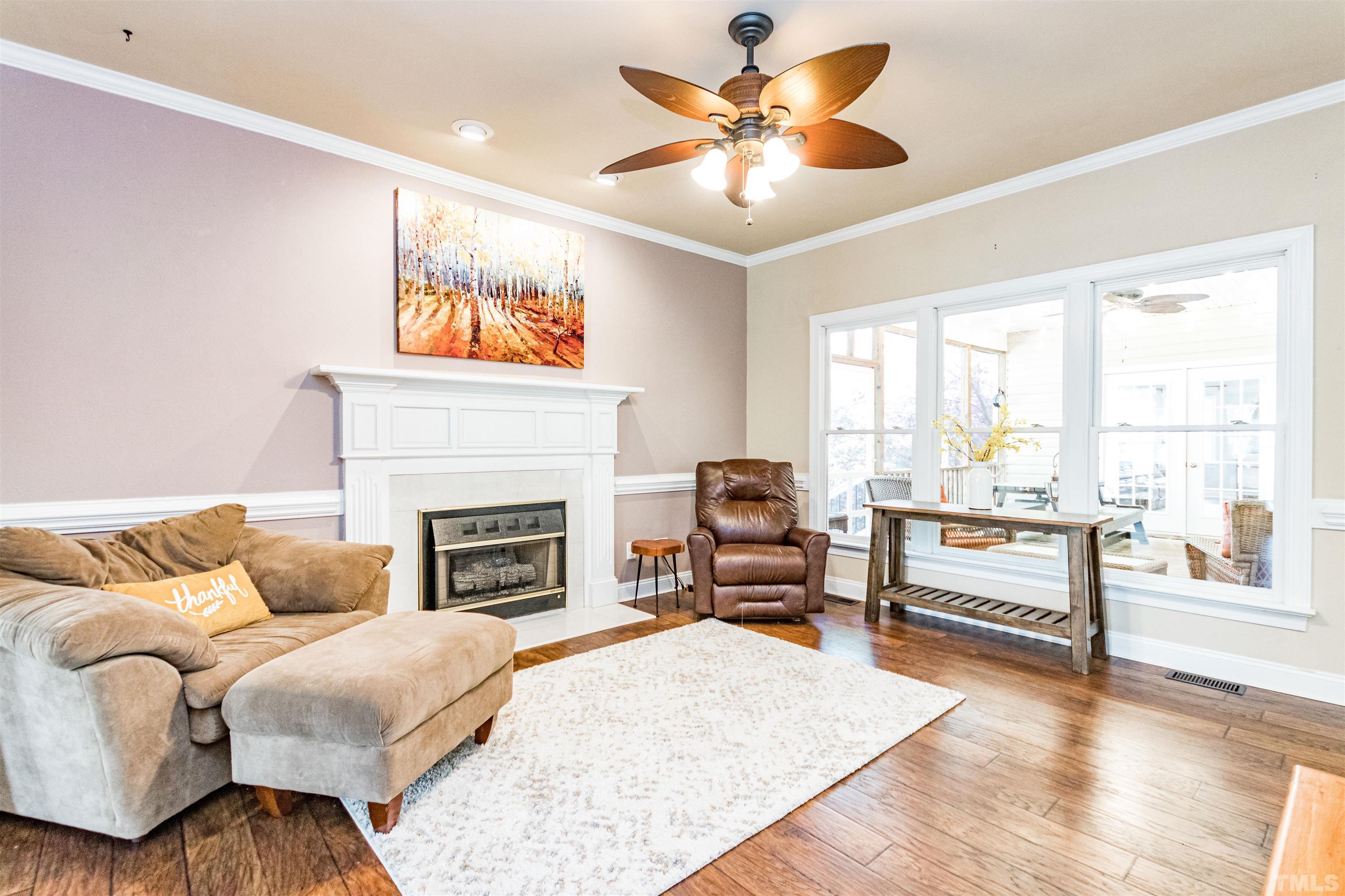 120 Kelsey Court Clayton, NC 27520 - Photo 11 of 62 a living room with furniture and a fireplace