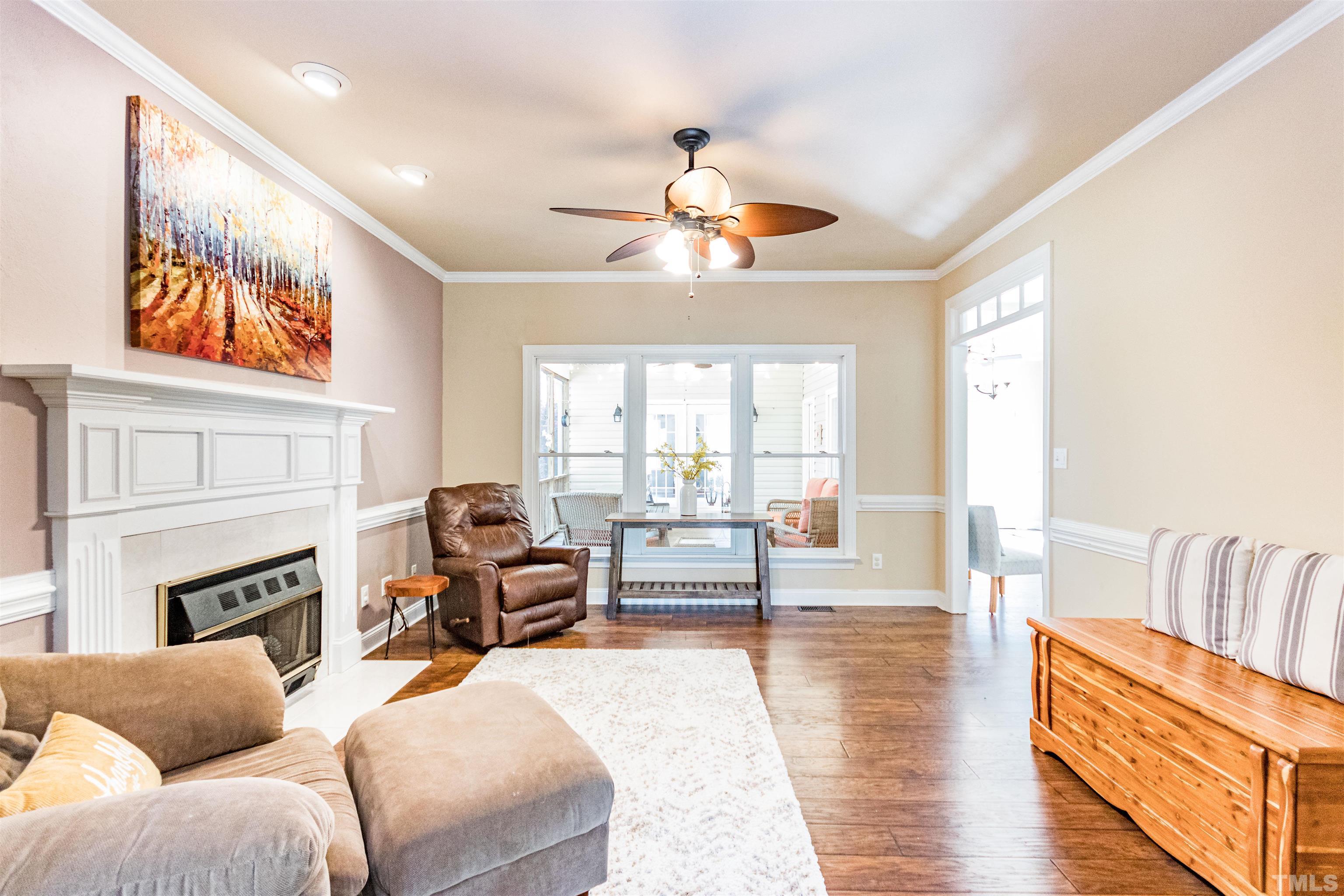 120 Kelsey Court Clayton, NC 27520 - Photo 12 of 62 a living room with furniture and a fireplace