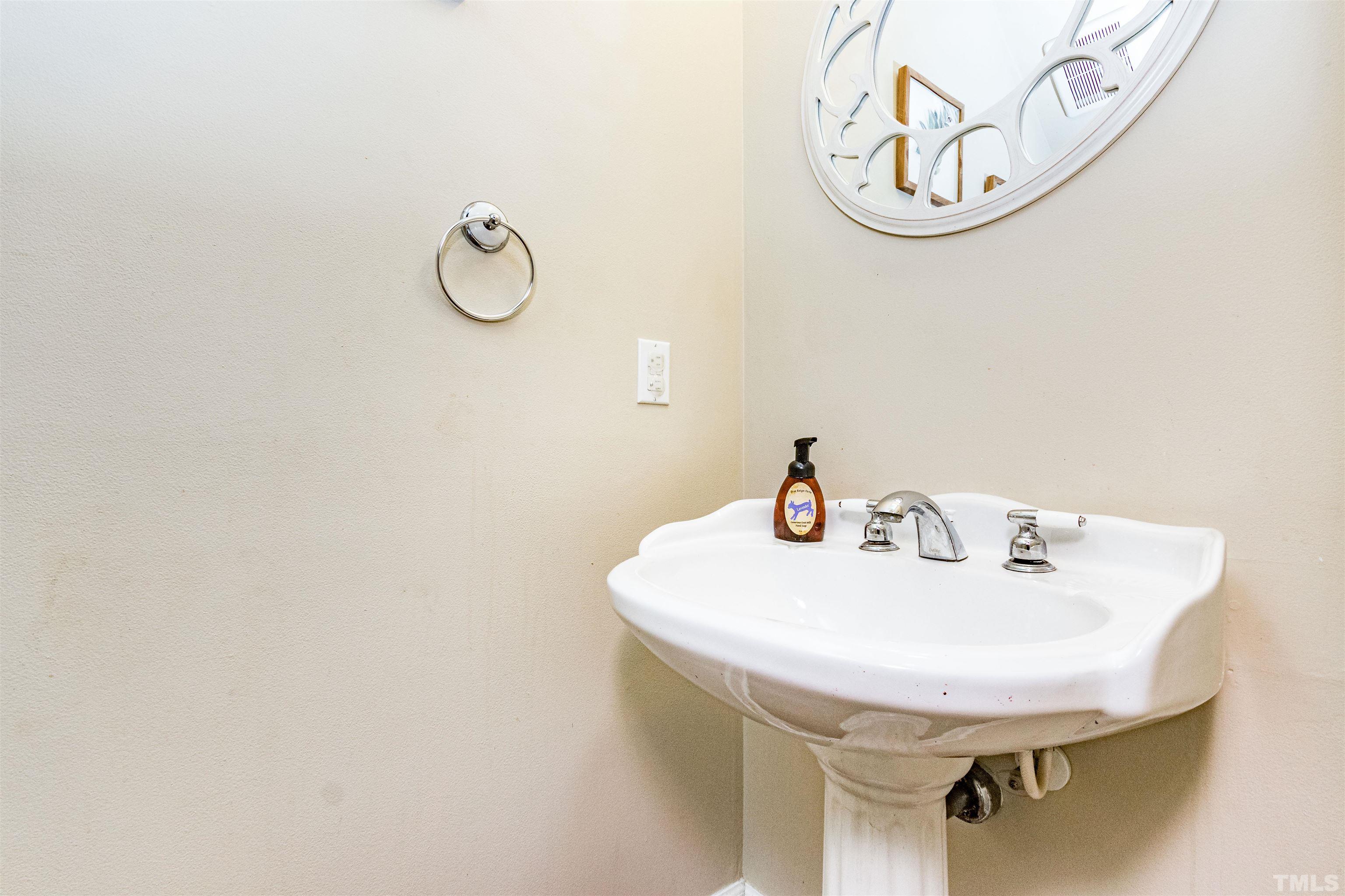 120 Kelsey Court Clayton, NC 27520 - Photo 20 of 62 a bathroom with a sink and a mirror