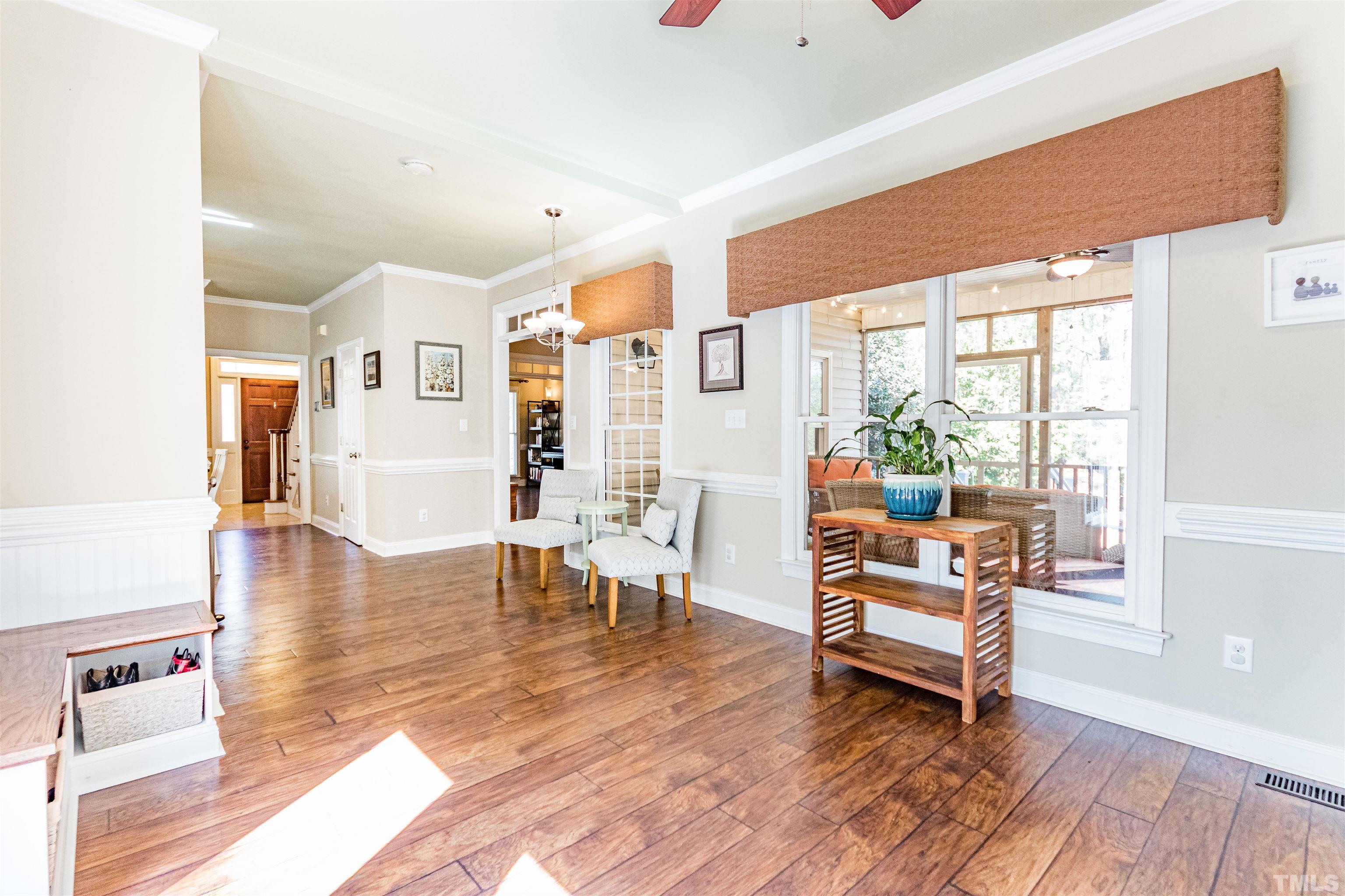 120 Kelsey Court Clayton, NC 27520 - Photo 22 of 62 a living room with furniture wooden floor and a table