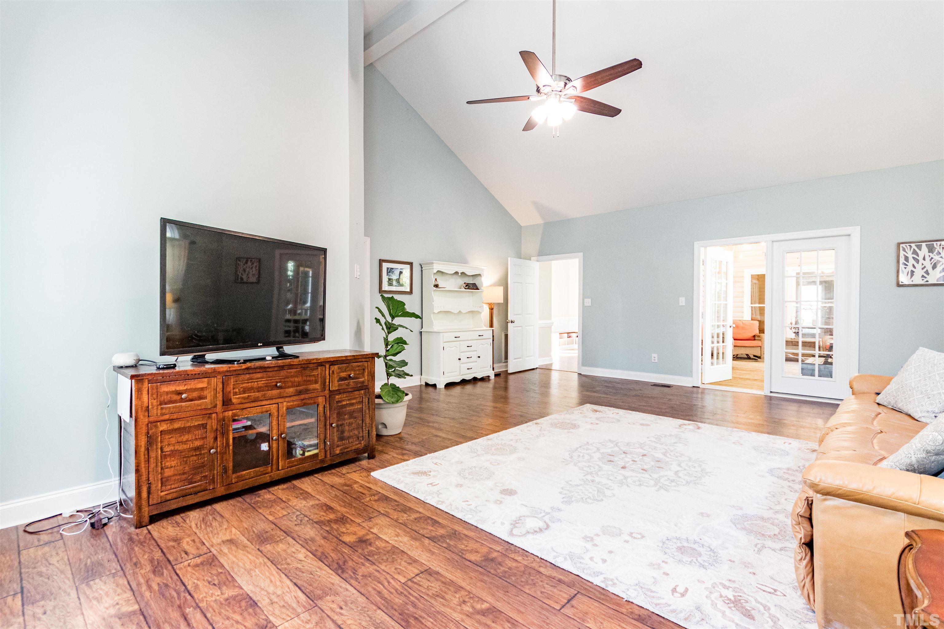 120 Kelsey Court Clayton, NC 27520 - Photo 26 of 62 a living room with furniture and a flat screen tv