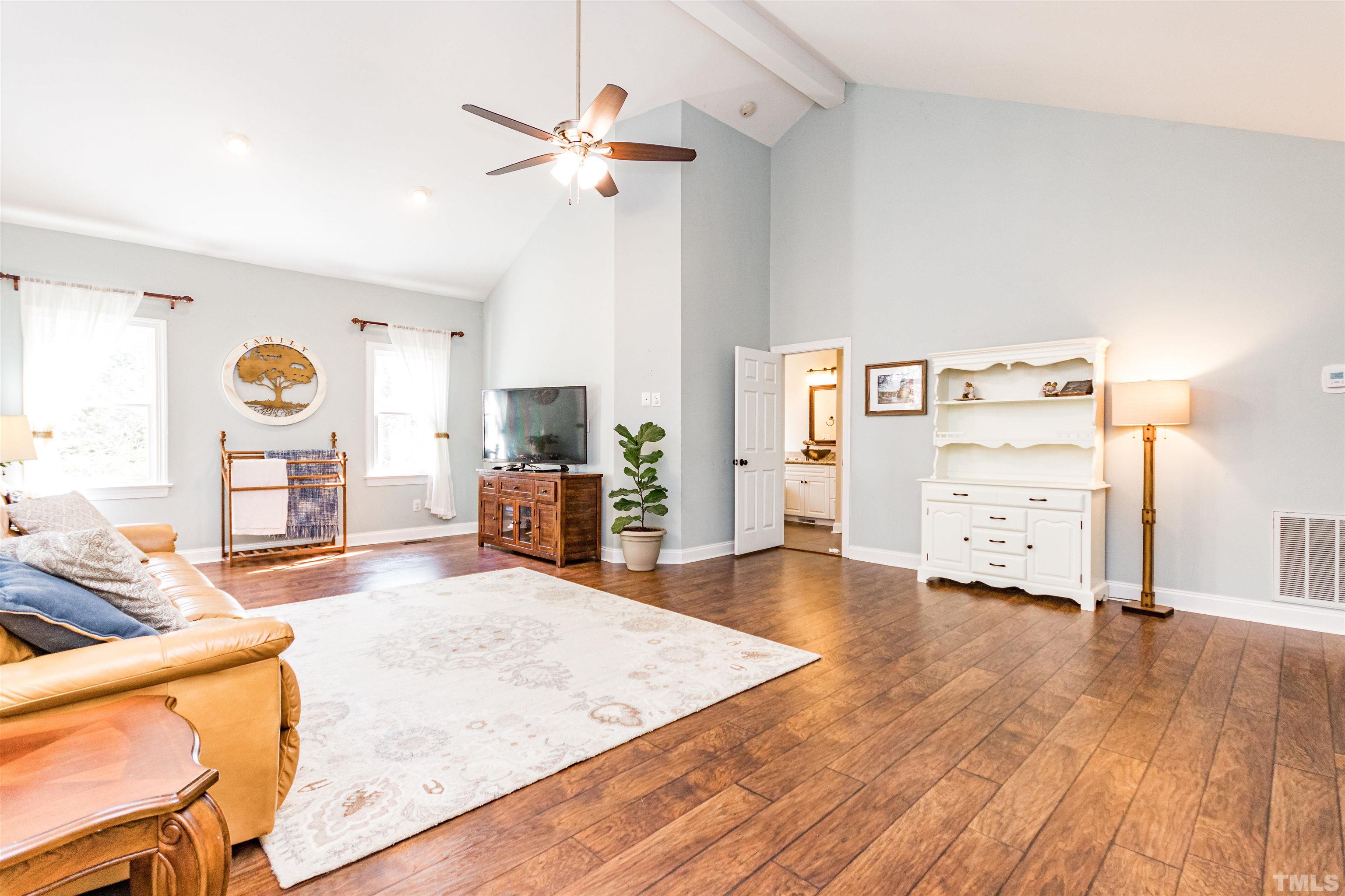 120 Kelsey Court Clayton, NC 27520 - Photo 27 of 62 a living room with furniture and wooden floor