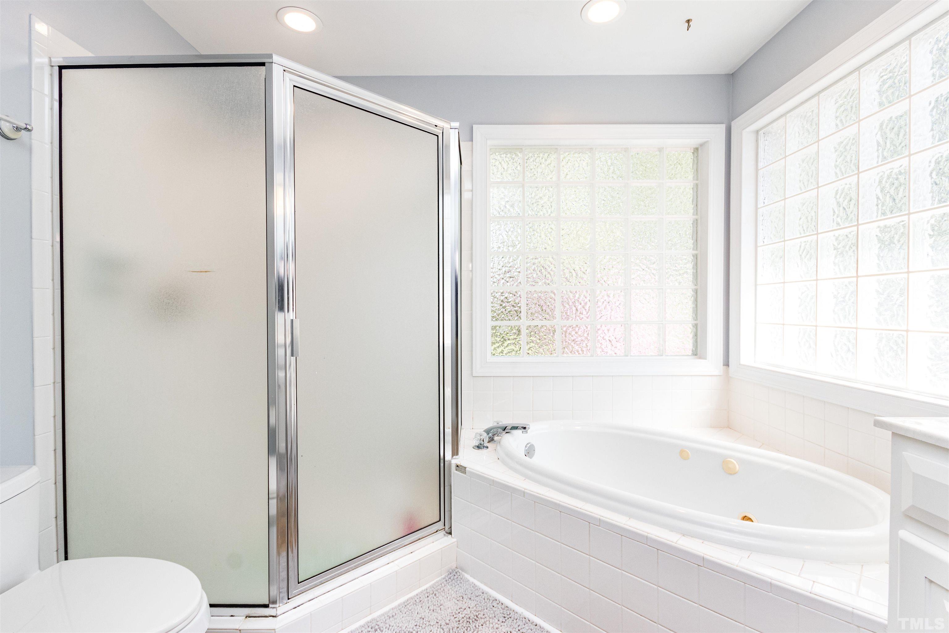 120 Kelsey Court Clayton, NC 27520 - Photo 33 of 62 a bathroom with a bathtub and a shower