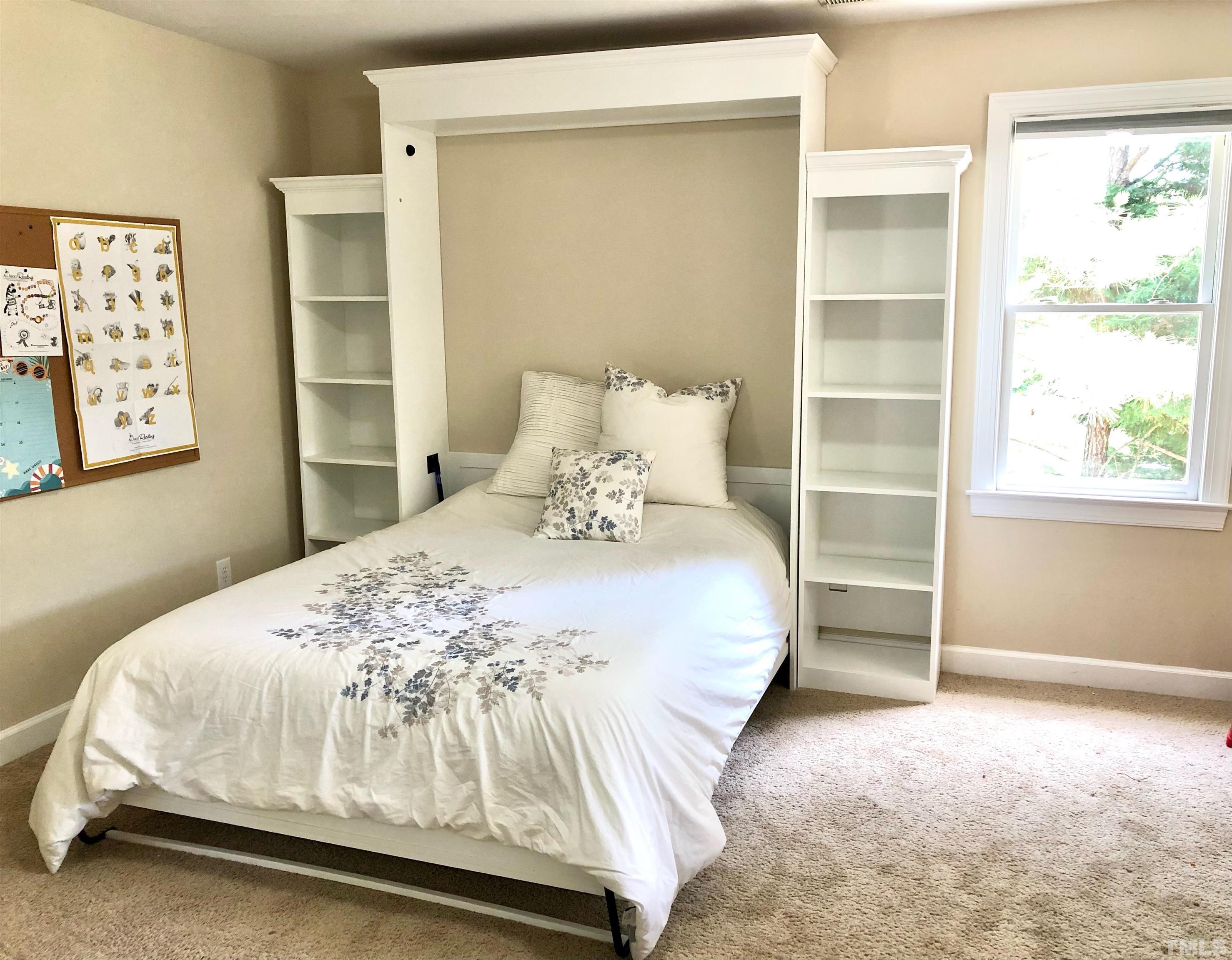 120 Kelsey Court Clayton, NC 27520 - Photo 39 of 62 a bedroom with a bed and a window