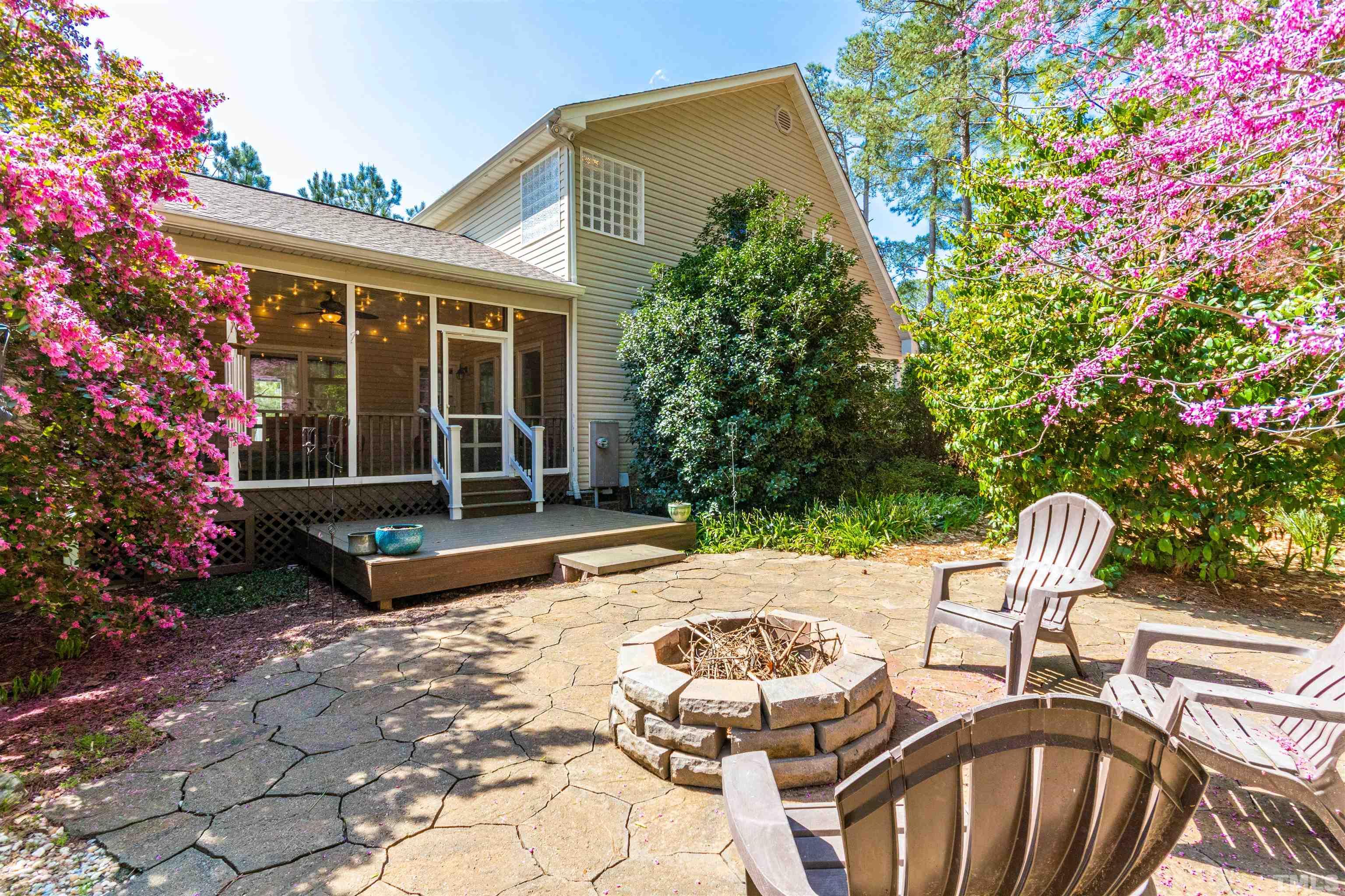 120 Kelsey Court Clayton, NC 27520 - Photo 52 of 62 a view of a patio with table and chairs and potted plants