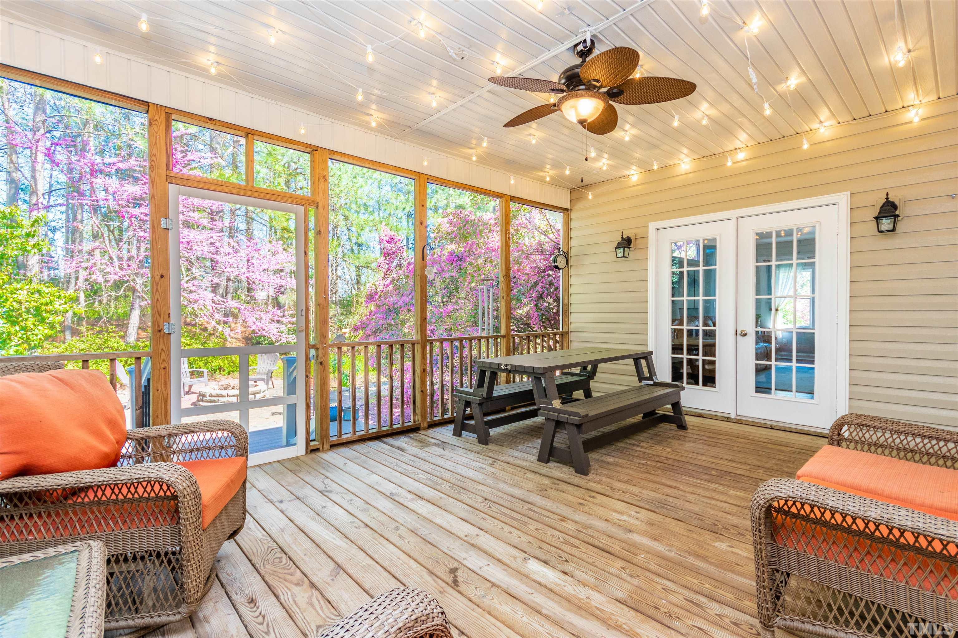 120 Kelsey Court Clayton, NC 27520 - Photo 53 of 62 a living room with furniture a flat screen tv and a large window