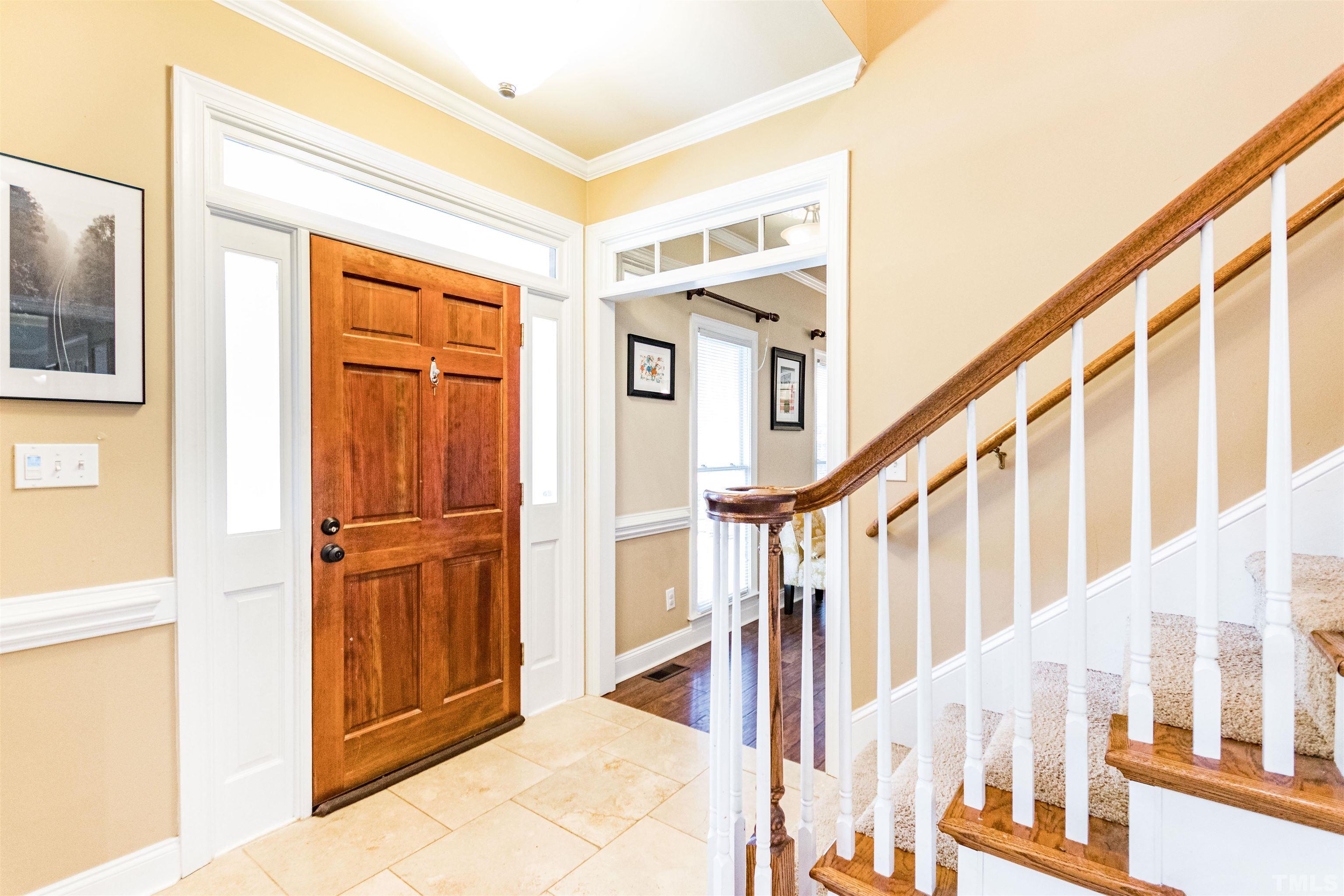 120 Kelsey Court Clayton, NC 27520 - Photo 7 of 62 a view of an entryway with wooden floor and door