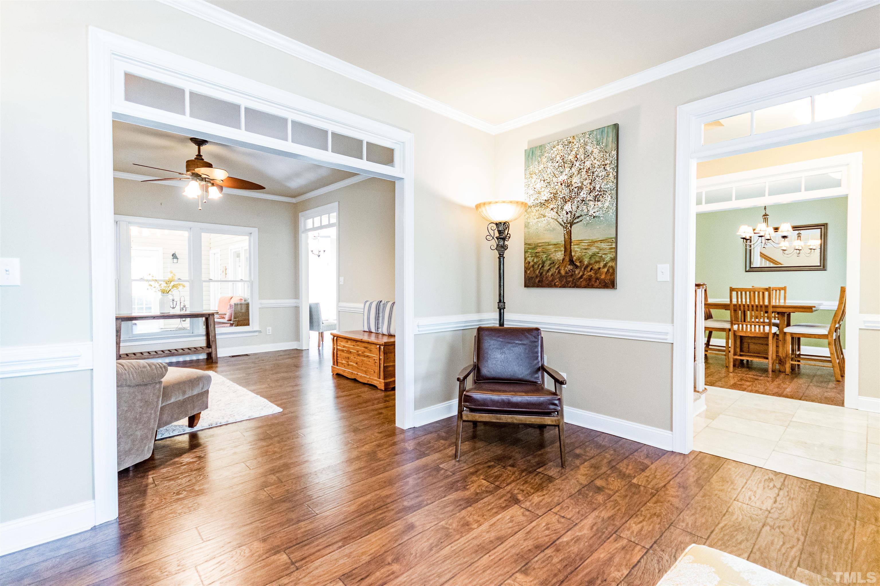 120 Kelsey Court Clayton, NC 27520 - Photo 9 of 62 a living room with furniture and a wooden floor