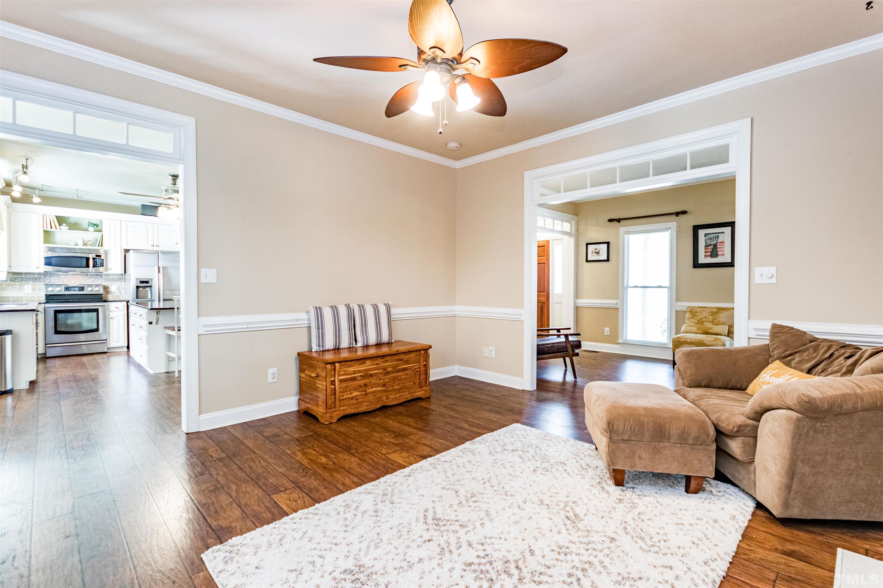 120 Kelsey Court Clayton, NC 27520 - Photo 10 of 62 a living room with furniture and wooden floor