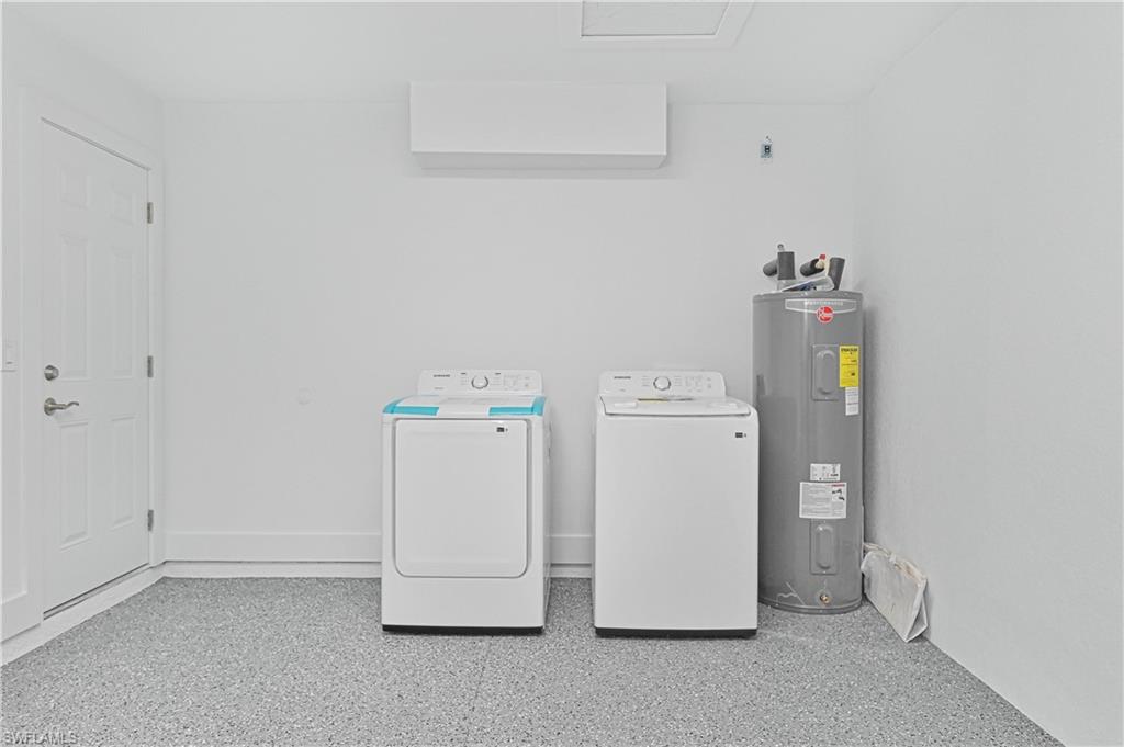 4709-4711 27th Street Southwest Lehigh Acres, FL 33973 - Photo 19 of 21 Laundry area featuring electric water heater and independent washer and dryer