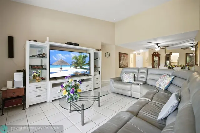 a bathroom with a toilet a sink a mirror and a shower