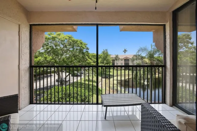 a bedroom with two beds and a flat screen tv