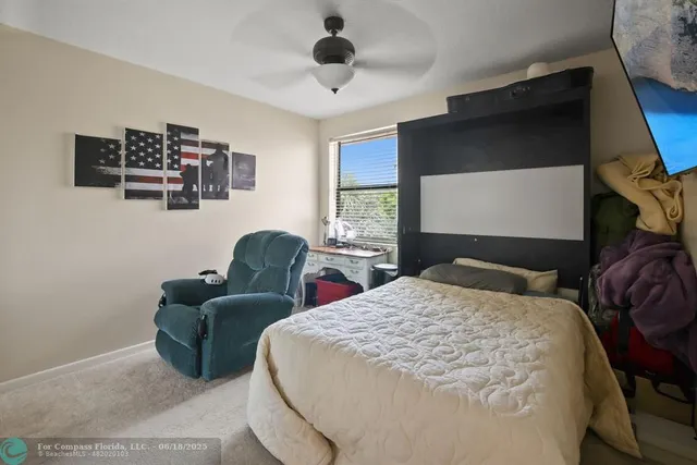 a bathroom with a sink a toilet and shower curtain