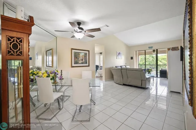 a view of a livingroom with furniture and chandelier