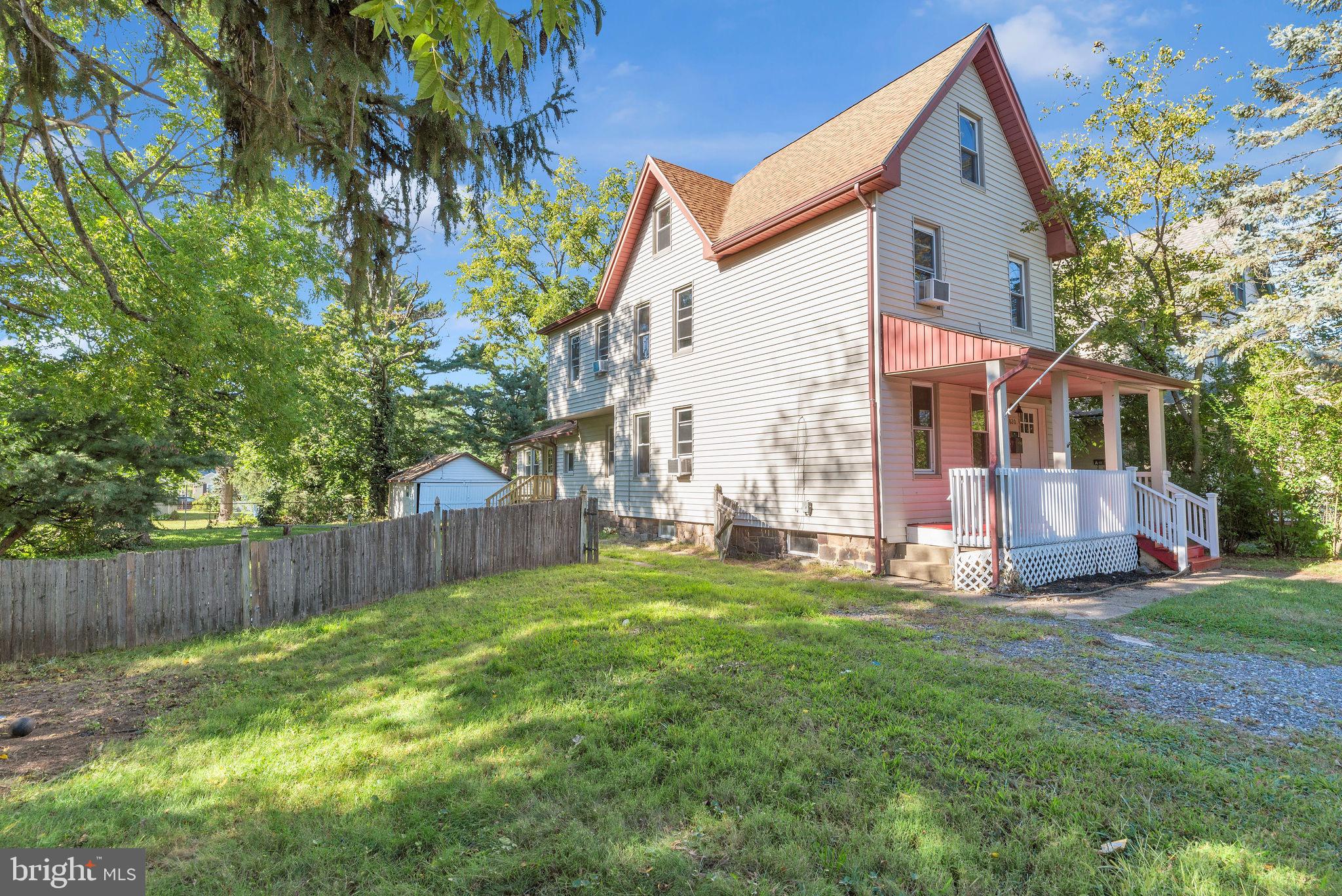 820 Laurel Street Delanco, NJ 08075 - Photo 2 of 24 Charming home with lush greenery and porch.