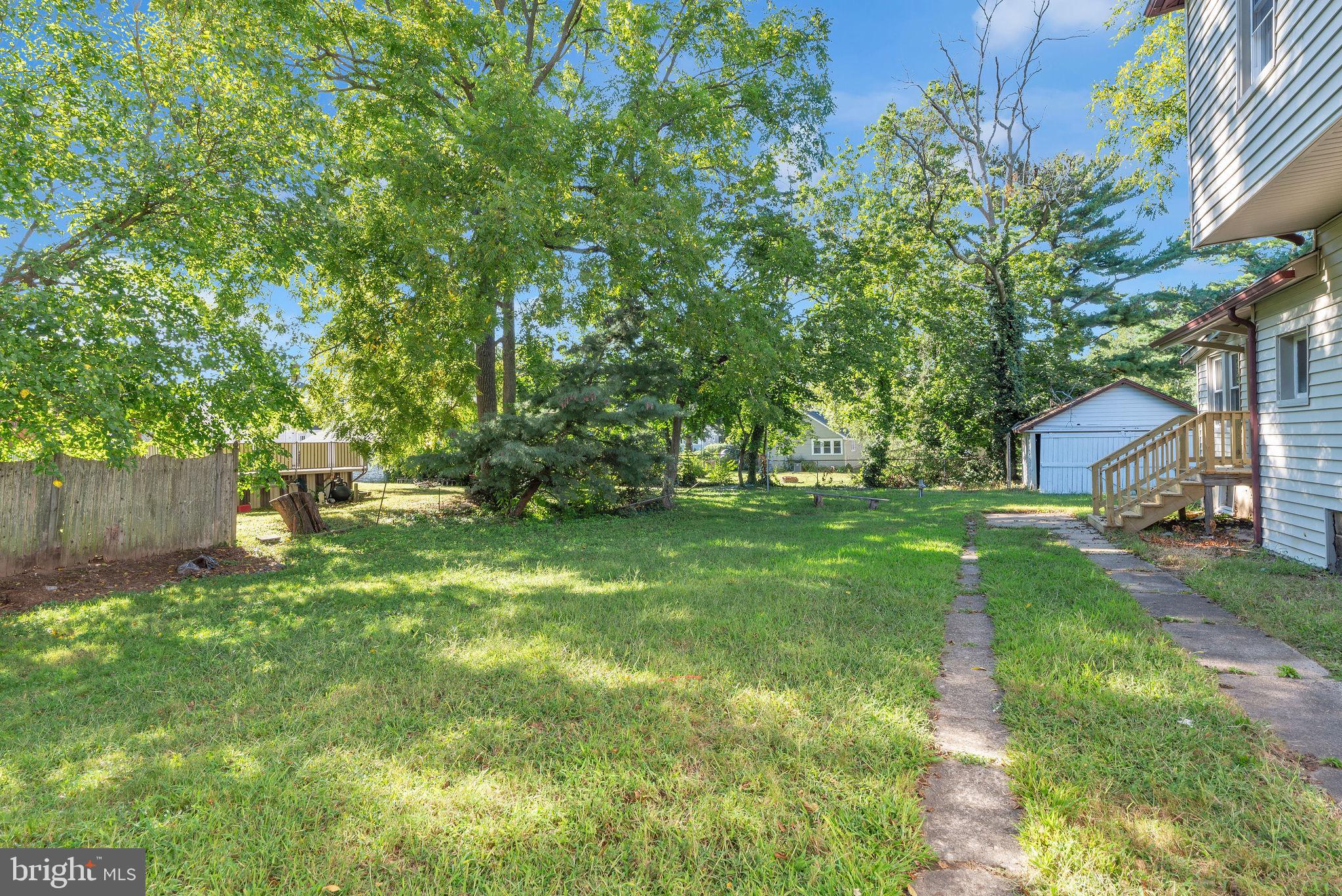 820 Laurel Street Delanco, NJ 08075 - Photo 21 of 24 Spacious yard embraced by lush greenery.