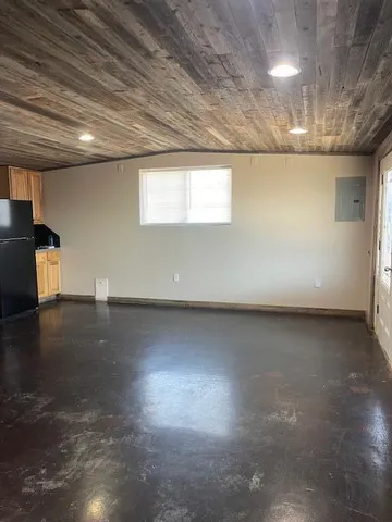 an empty room with wooden floor