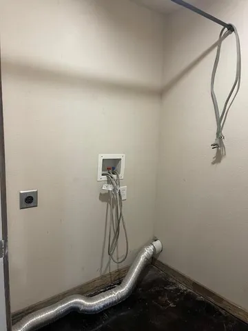 a room with a table and a chandelier