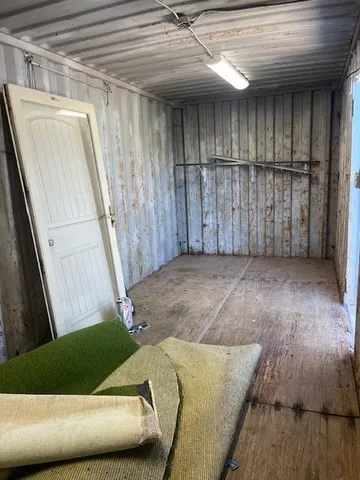 a view of a room with wooden floor and staircase