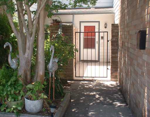 a view of a house with a potted plant