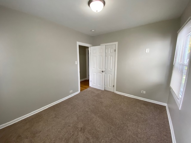 17843 Roy Street Lansing, IL 60438 - Photo 13 of 19 an empty room with windows and entrance