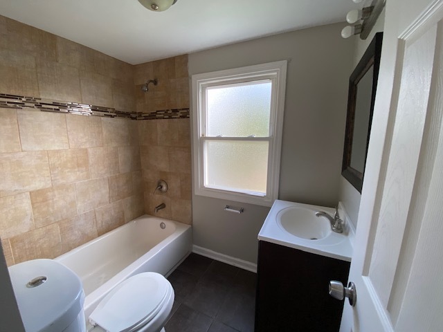 17843 Roy Street Lansing, IL 60438 - Photo 19 of 19 a bathroom with a sink toilet and shower