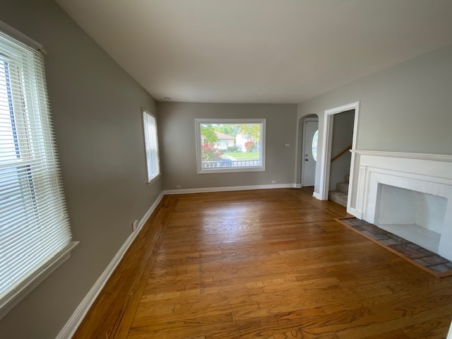 17843 Roy Street Lansing, IL 60438 - Photo 5 of 19 a view of an empty room with window and wooden floor