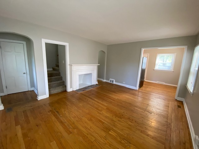 17843 Roy Street Lansing, IL 60438 - Photo 6 of 19 a view of empty room with wooden floor and fan