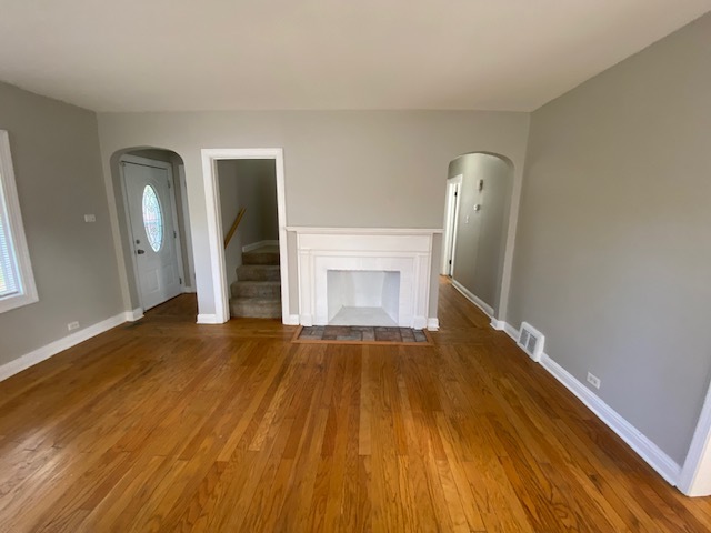 17843 Roy Street Lansing, IL 60438 - Photo 8 of 19 a view of an empty room with wooden floor and a window
