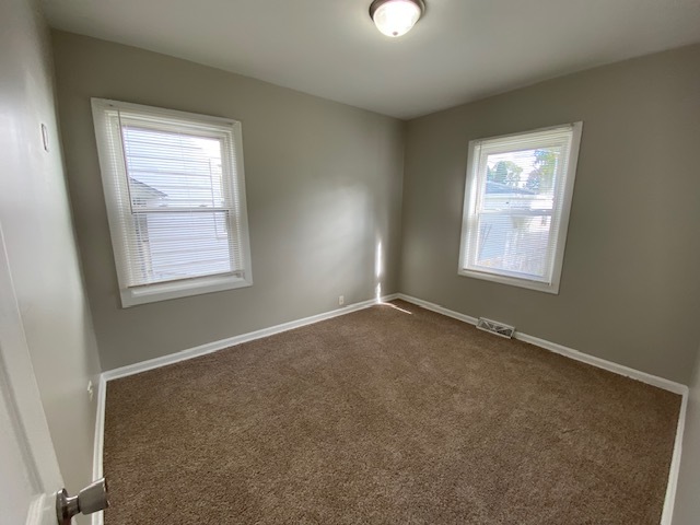 17843 Roy Street Lansing, IL 60438 - Photo 9 of 19 an empty room with windows