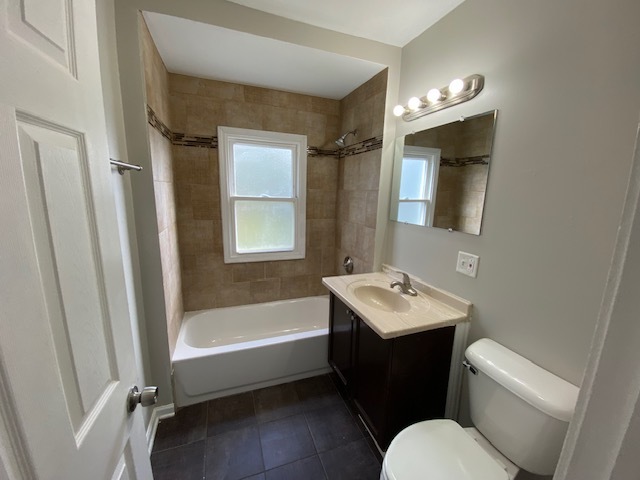 17843 Roy Street Lansing, IL 60438 - Photo 10 of 19 a bathroom with a sink toilet tub and mirror