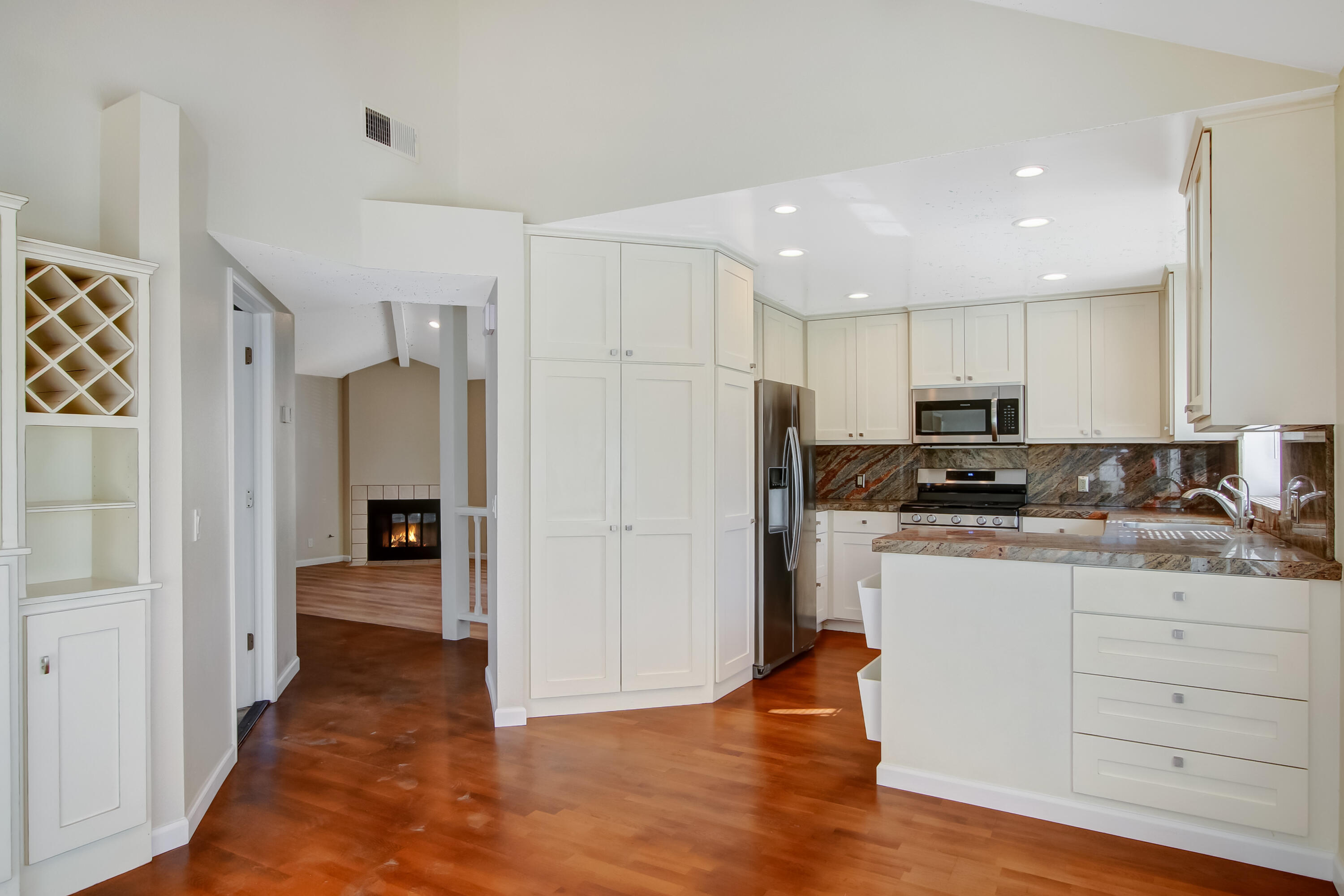 1541 Meadow Circle Carpinteria, CA 93013 - Photo 22 of 36 a kitchen with stainless steel appliances granite countertop a refrigerator and a stove top oven